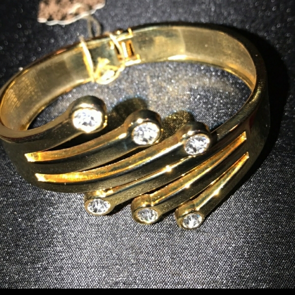Very unique cuff encrusted with rhinestones set in a gold tone. - Picture 2 of 2
